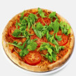 Arugula pizza with poached eggs
