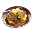 Braised beef steaks with zesty sauce