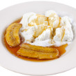 Caribbean banana flambe with pineapple curd over frozen yogurt